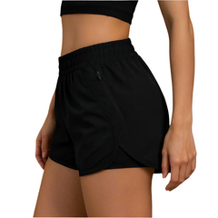 Person wearing black athletic shorts on a brown background